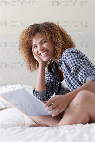 Mid adult woman relaxing at home