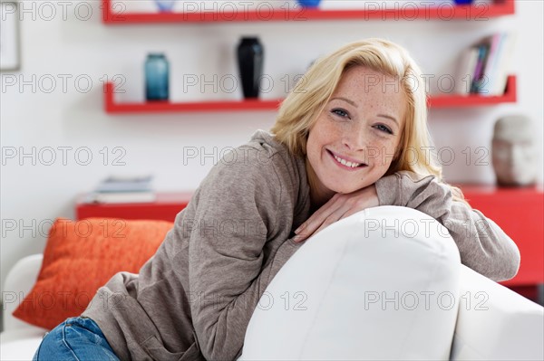 Portrait of young woman relaxing at home