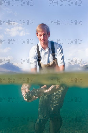 Man holding western cutthroat trout c