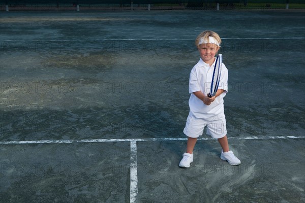 Boy playing tennis