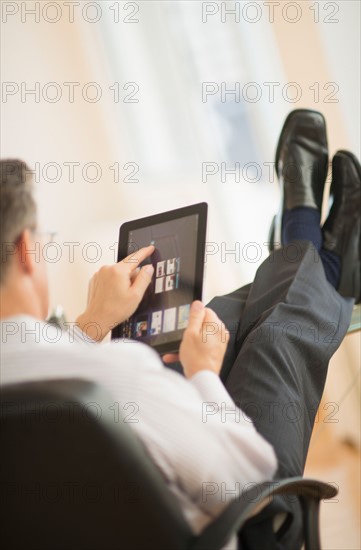 Man using tablet pc.