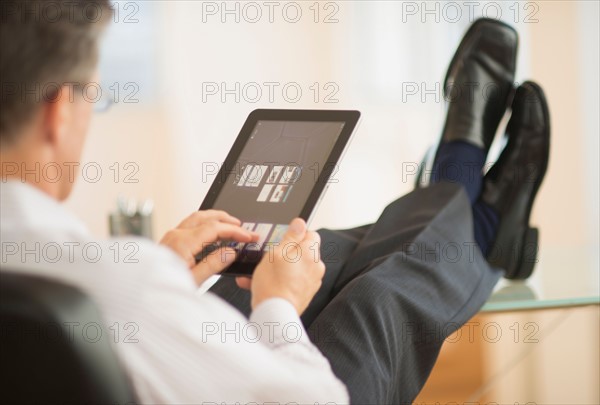 Man using tablet pc.