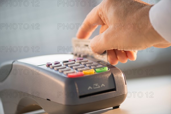 Hand paying with credit card.