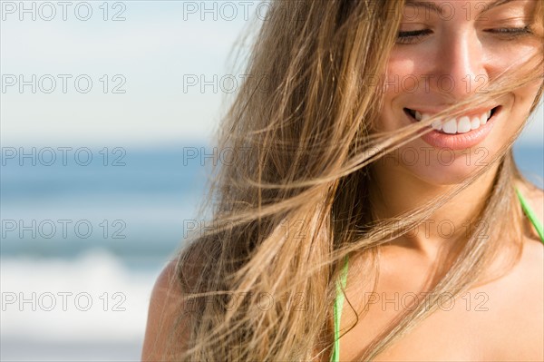 Beautiful woman at beach. Photo : Jamie Grill