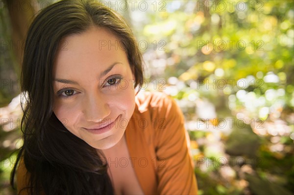 Portrait of woman in forest. Photo : Jamie Grill