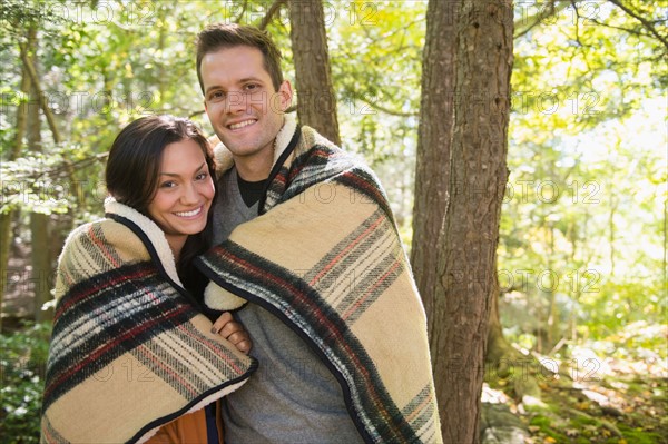 Portrait of couple in forest. Photo : Jamie Grill