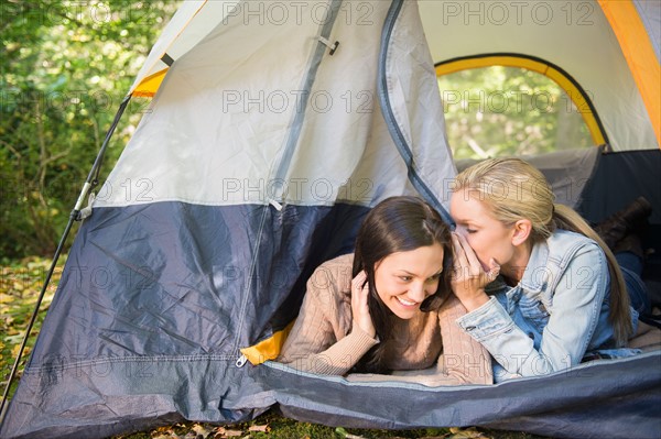 Two women lying in tent. Photo : Jamie Grill