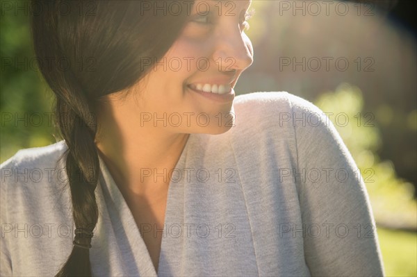 Smiling woman outdoors. Photo : Jamie Grill