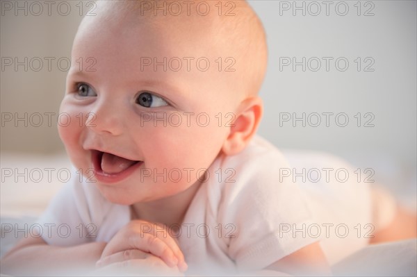 Portrait of laughing baby boy (2-5 months). Photo: Jamie Grill