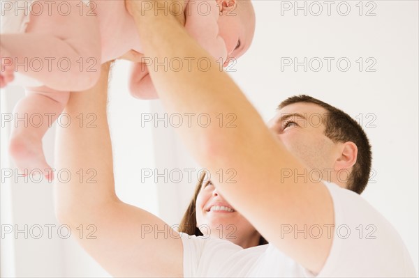 Father holding baby boy (2-5 months). Photo: Jamie Grill