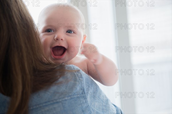 baby boy (2-5 months) laughing. Photo : Jamie Grill