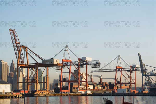 Cranes in harbor. Photo : Alan Schein