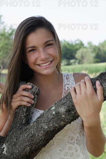 Outdoor portrait of smiling girl (12-13) . Photo: pauline st.denis