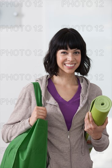 Portrait of young woman going for fitness. Photo : Dan Bannister