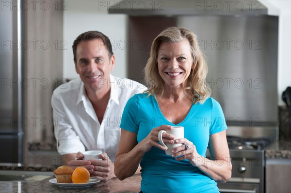 Mature couple drinking coffee. Photo: Dan Bannister