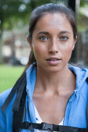 Portrait of young woman with backpack. Photo : Jan Scherders