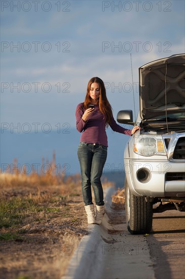 Woman calling for assistance after vehicle breakdown. Photo: Noah Clayton