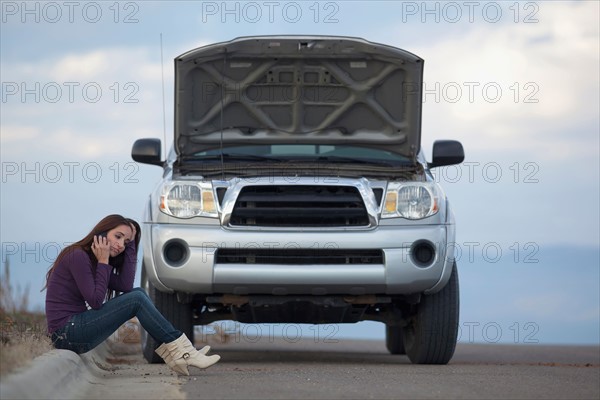 Woman calling for assistance after vehicle breakdown. Photo: Noah Clayton