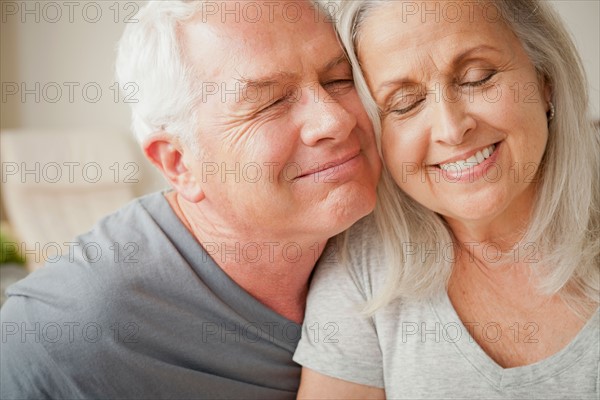 Portrait of senior couple in close embrace. Photo : Rob Lewine