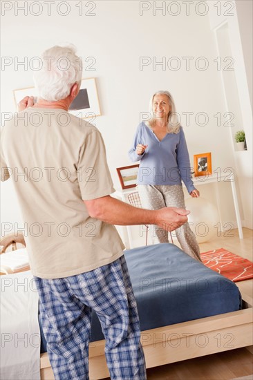 Senior couple dancing in bedroom. Photo : Rob Lewine