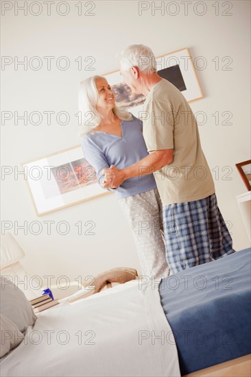 Senior couple dancing in bedroom. Photo: Rob Lewine