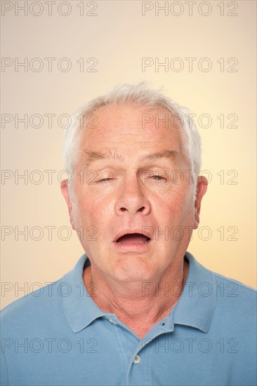 Portrait of senior man pulling funny face. Photo : Rob Lewine