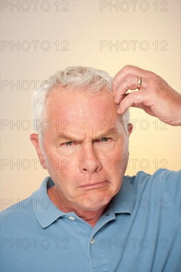 Portrait of senior man pulling funny face. Photo : Rob Lewine