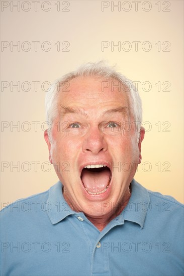Portrait of senior man screaming. Photo : Rob Lewine