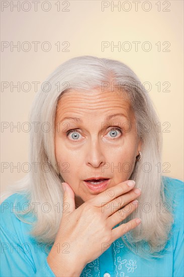 Portrait of senior woman with surprise face expression. Photo : Rob Lewine