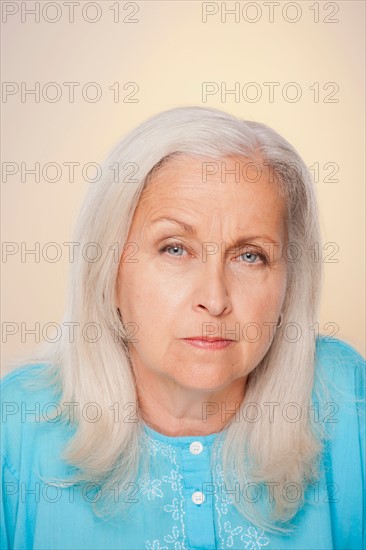 Portrait of senior woman with suspicious face expression. Photo : Rob Lewine