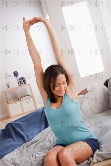 Woman stretching after waking up. Photo : Rob Lewine