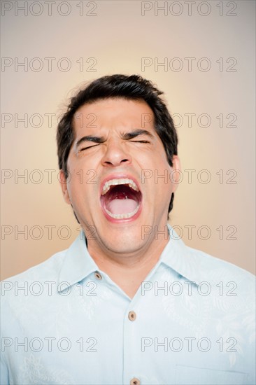 Portrait of man shouting. Photo : Rob Lewine