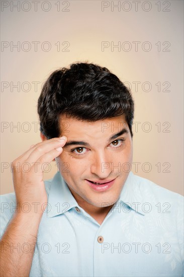 Portrait of man saluting. Photo : Rob Lewine