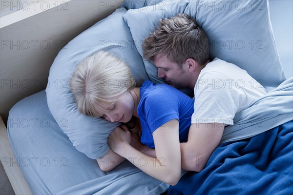 Elevated view of sleeping couple. Photo : Rob Lewine