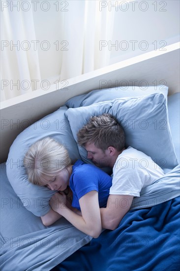 Elevated view of sleeping couple. Photo: Rob Lewine