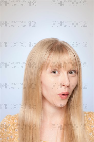 Portrait of woman looking surprised. Photo : Rob Lewine