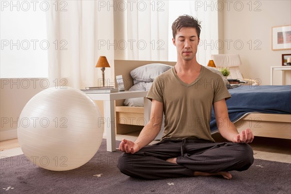 Portrait of man doing yoga. Photo: Rob Lewine