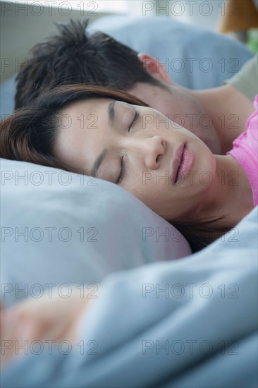 Close up of couple sleeping. Photo: Rob Lewine