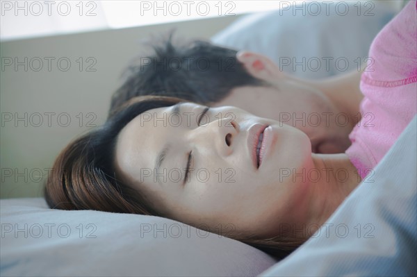 Close up of couple sleeping. Photo : Rob Lewine