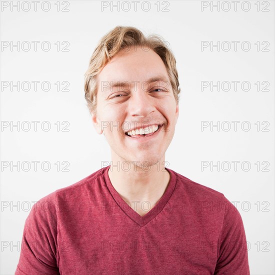 Studio Shot of mid adult man expressing happiness. Photo : Jessica Peterson