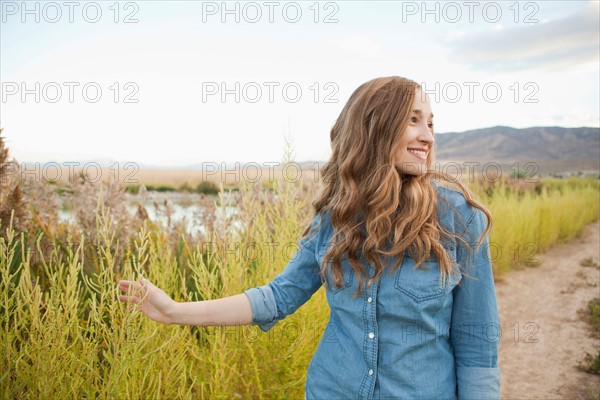 Portrait of young woman on dirt road. Photo: Jessica Peterson