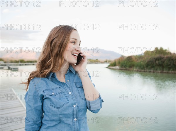 Portrait of young woman talking on phone. Photo : Jessica Peterson