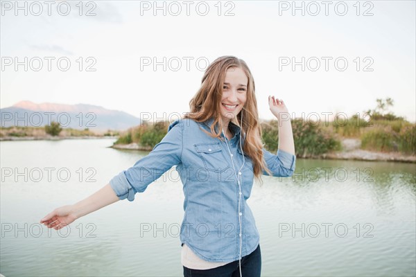 Portrait of young woman dancing player by lake. Photo: Jessica Peterson