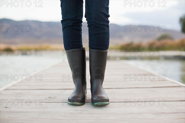 Low section of woman standing on jetty. Photo : Jessica Peterson