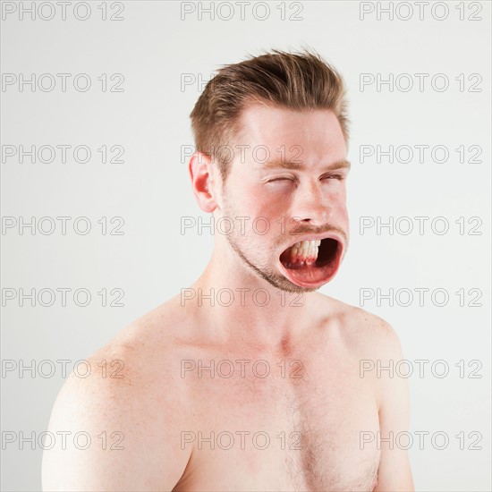 Studio shot of man with windblown mouth. Photo : Jessica Peterson