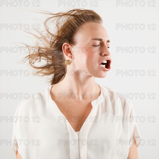 Studio shot of woman with windblown mouth. Photo : Jessica Peterson