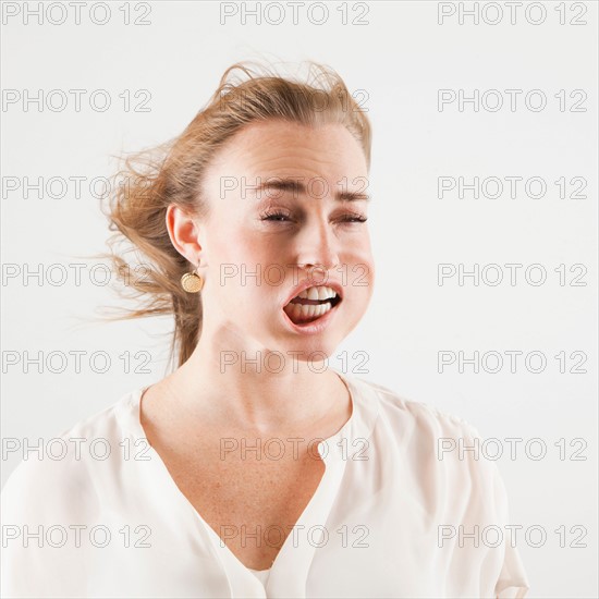 Studio shot of woman with windblown mouth. Photo : Jessica Peterson