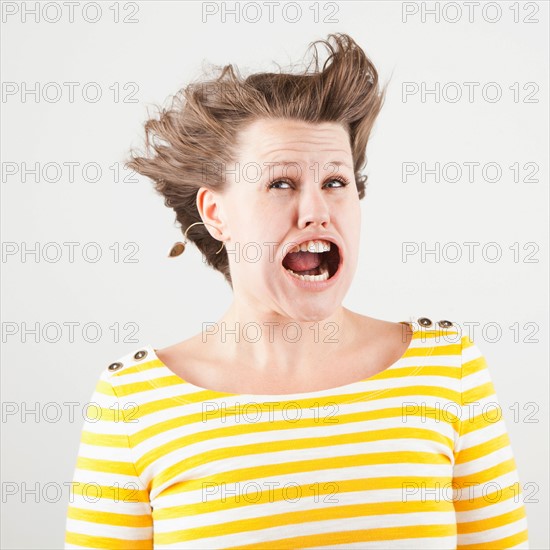 Studio shot of woman with windblown mouth. Photo : Jessica Peterson