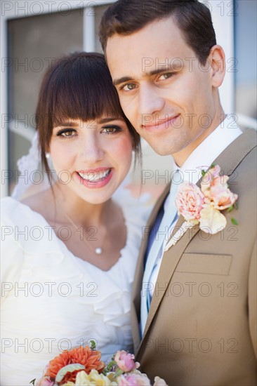 Portrait of young bride and groom. Photo: Jessica Peterson