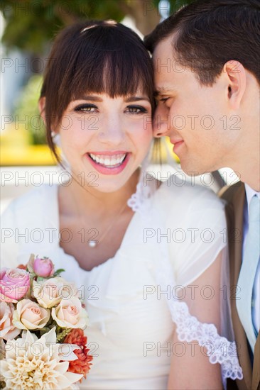 Portrait of young bride and groom. Photo : Jessica Peterson